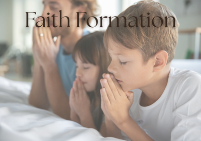 Children praying during faith formation